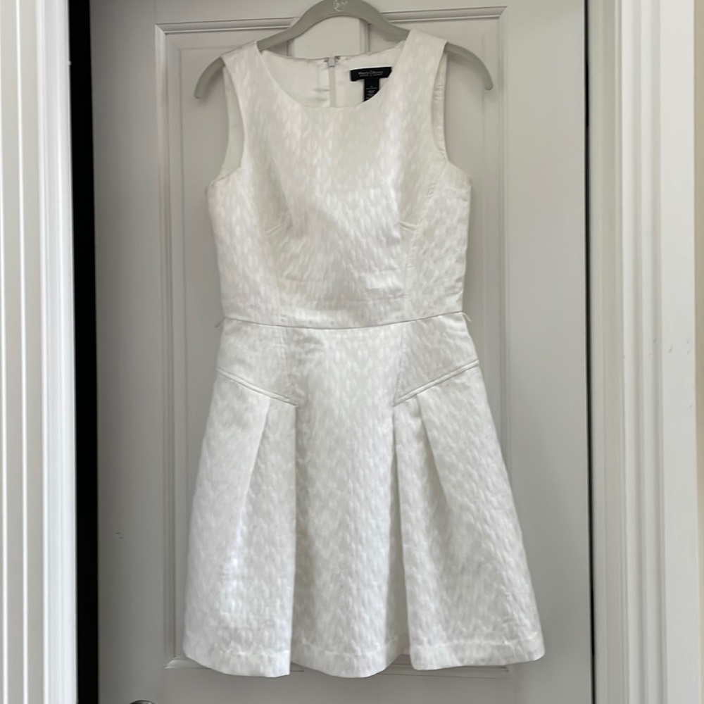 All white textured dress. Perfect for HS or college graduation.  Worn one time.